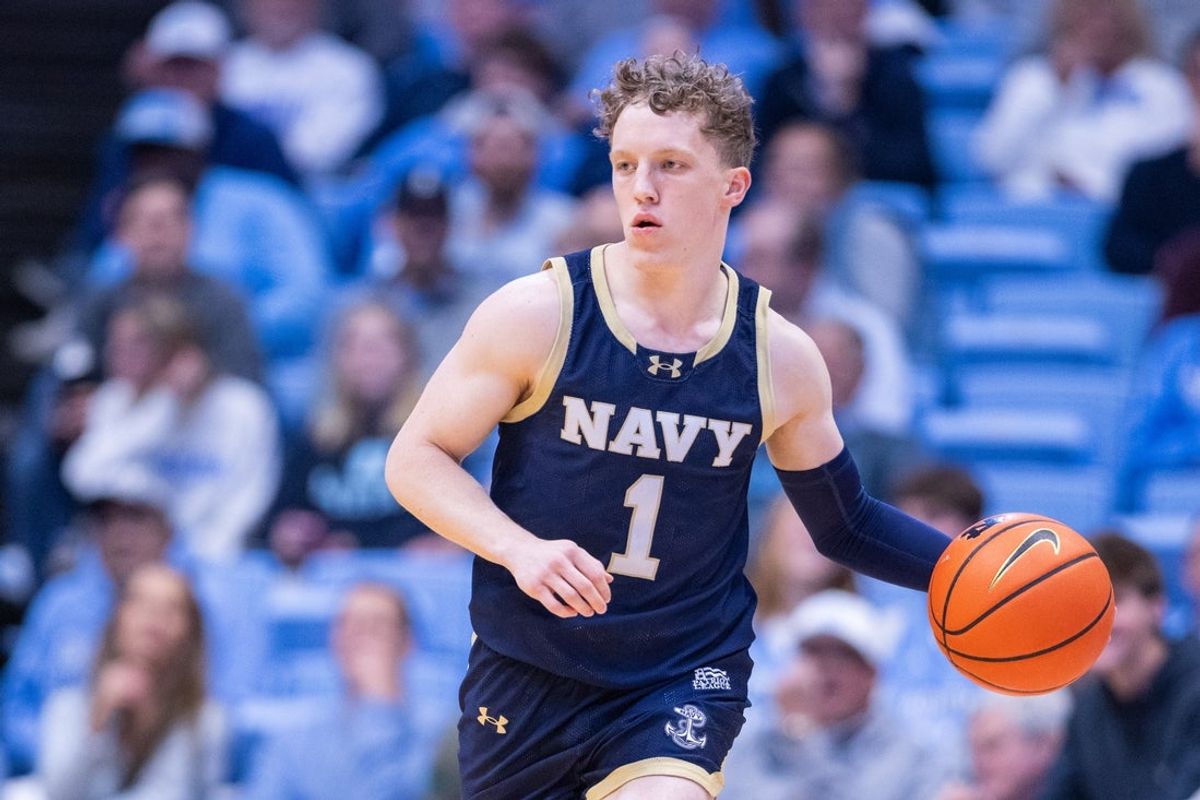 Nov 18, 2025; Chapel Hill, North Carolina, USA; Navy Midshipmen guard Austin Benigni (1) brings the ball up court against the North Carolina Tar Heels in the first half at Dean E. Smith Center. Mandatory Credit: Scott Kinser-Imagn Images