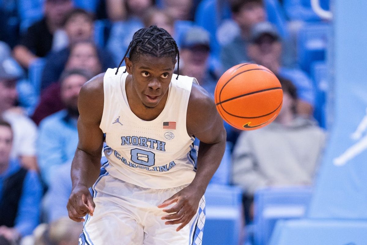 Nov 18, 2025; Chapel Hill, North Carolina, USA; North Carolina Tar Heels forward Caleb Wilson (8) brings the ball up court against the Navy Midshipmen during the second half at Dean E. Smith Center. Mandatory Credit: Scott Kinser-Imagn Images