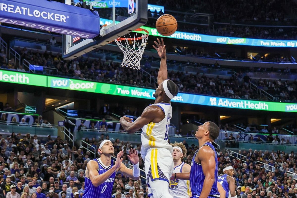 Nov 18, 2025; Orlando, Florida, USA; Golden State Warriors forward Jimmy Butler III (10) goes to the basket against Orlando Magic guard Anthony Black (0) and guard Desmond Bane (3) during the second half at Kia Center. Mandatory Credit: Mike Watters-Imagn Images
