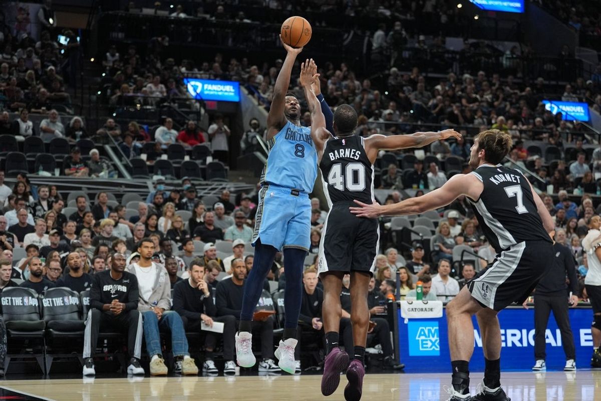 Nov 18, 2025; San Antonio, Texas, USA;  Memphis Grizzlies forward Jaren Jackson Jr. (8) shoots over San Antonio Spurs forward Harrison Barnes (40) in the second half at Frost Bank Center. Mandatory Credit: Daniel Dunn-Imagn Images