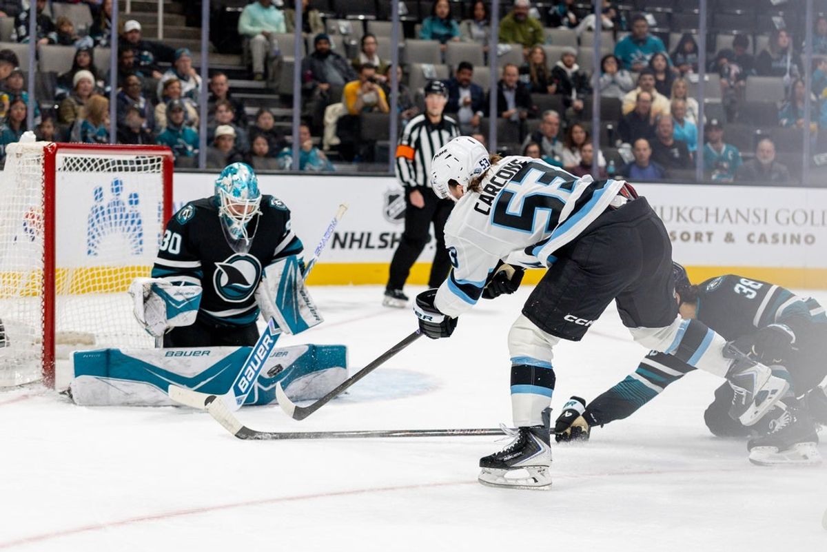 Nov 18, 2025; San Jose, California, USA; Utah Mammoth left wing Michael Carcone (53) shoots during the first period against the San Jose Sharks at SAP Center at San Jose. Mandatory Credit: Bob Kupbens-Imagn Images