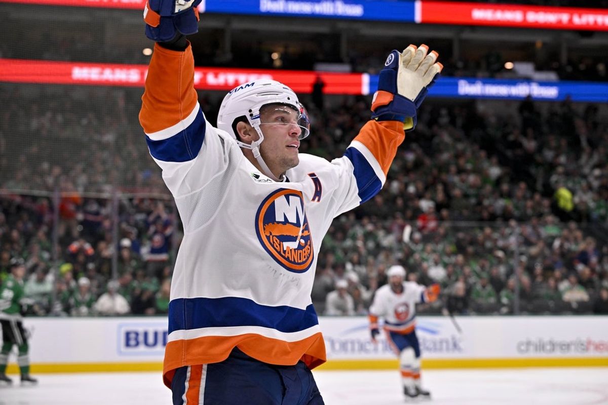 Nov 18, 2025; Dallas, Texas, USA; New York Islanders center Bo Horvat (14) celebrates after scoring a goal against the Dallas Stars during the third period at the American Airlines Center. Mandatory Credit: Jerome Miron-Imagn Images
