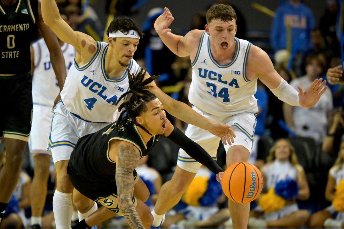 Nov 18, 2025; Los Angeles, California, USA;  UCLA Bruins guard Jamar Brown (4) and forward Tyler Bilodeau (34) defend Sacramento State Hornets guard Jahni Summers (4) during the second half at Pauley Pavilion presented by Wescom Financial. Mandatory Credit: Jayne Kamin-Oncea-Imagn Images
