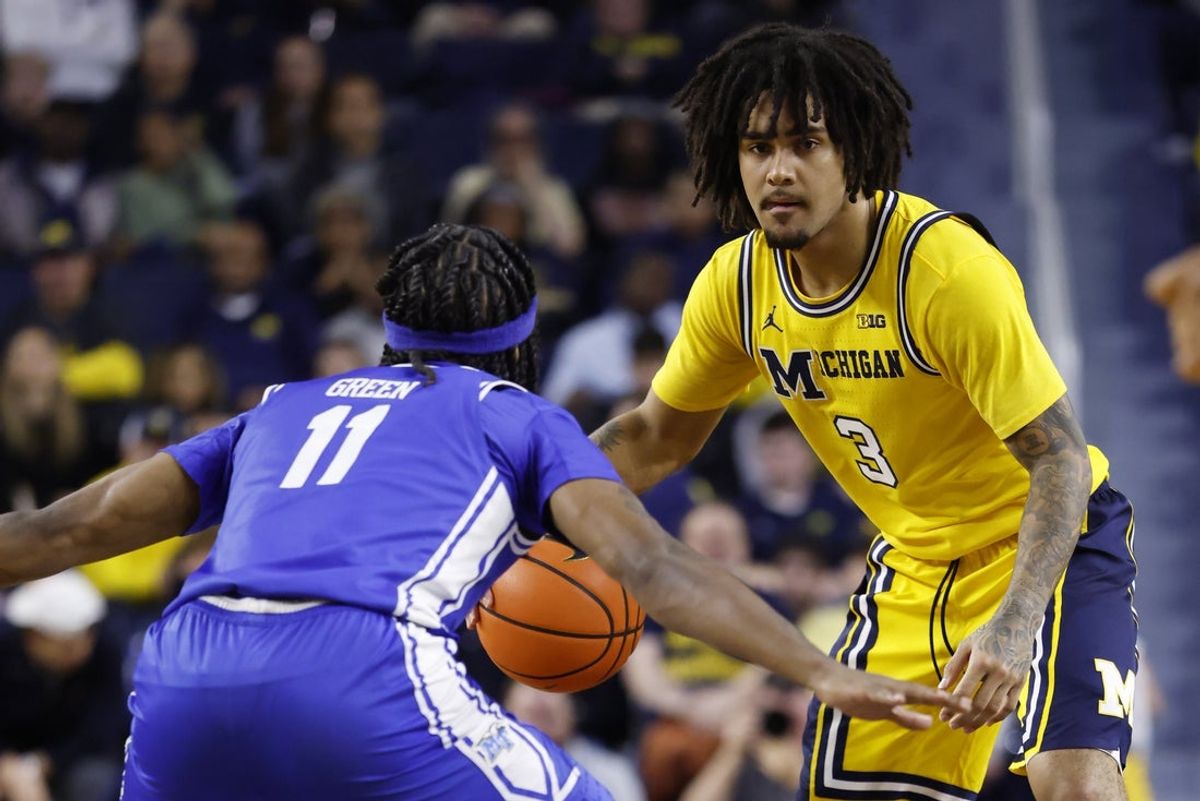 Nov 19, 2025; Ann Arbor, Michigan, USA; Michigan Wolverines guard Elliot Cadeau (3) dribbles defended by Middle Tennessee Blue Raiders guard Tre Green (11) in the first half at Crisler Center. Mandatory Credit: Rick Osentoski-Imagn Images