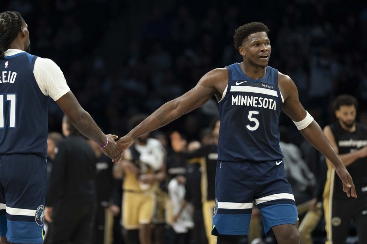 Nov 19, 2025; Minneapolis, Minnesota, USA; Minnesota Timberwolves guard Anthony Edwards (5) celebrates with Minnesota Timberwolves center Naz Reid (11) after making a shot against the Washington Wizards in the first half at Target Center. Mandatory Credit: Jesse Johnson-Imagn Images