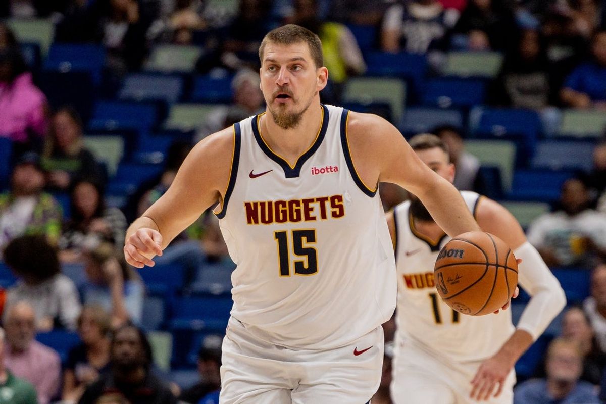 Nov 19, 2025; New Orleans, Louisiana, USA;  Denver Nuggets center Nikola Jokic (15) brings the ball up court against the New Orleans Pelicans during the first half  at Smoothie King Center. Mandatory Credit: Stephen Lew-Imagn Images