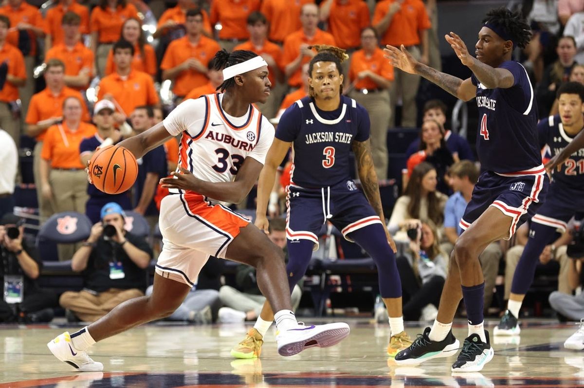 Nov 19, 2025; Auburn, Alabama, USA; Auburn Tigers forward Sebastian Williams-Adams (33) passes the ball against the Jackson State Tigers during the first half at Neville Arena. Mandatory Credit: John Reed-Imagn Images