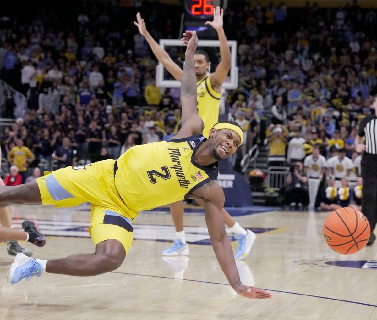 Marquette guard Chase Ross (2) falls while pursing a ball during the second half of their game Wednesday, November 19, 2025 at Fiserv Forum in Milwaukee, Wisconsin. Dayton beat Marquette 77-71 in overtime.