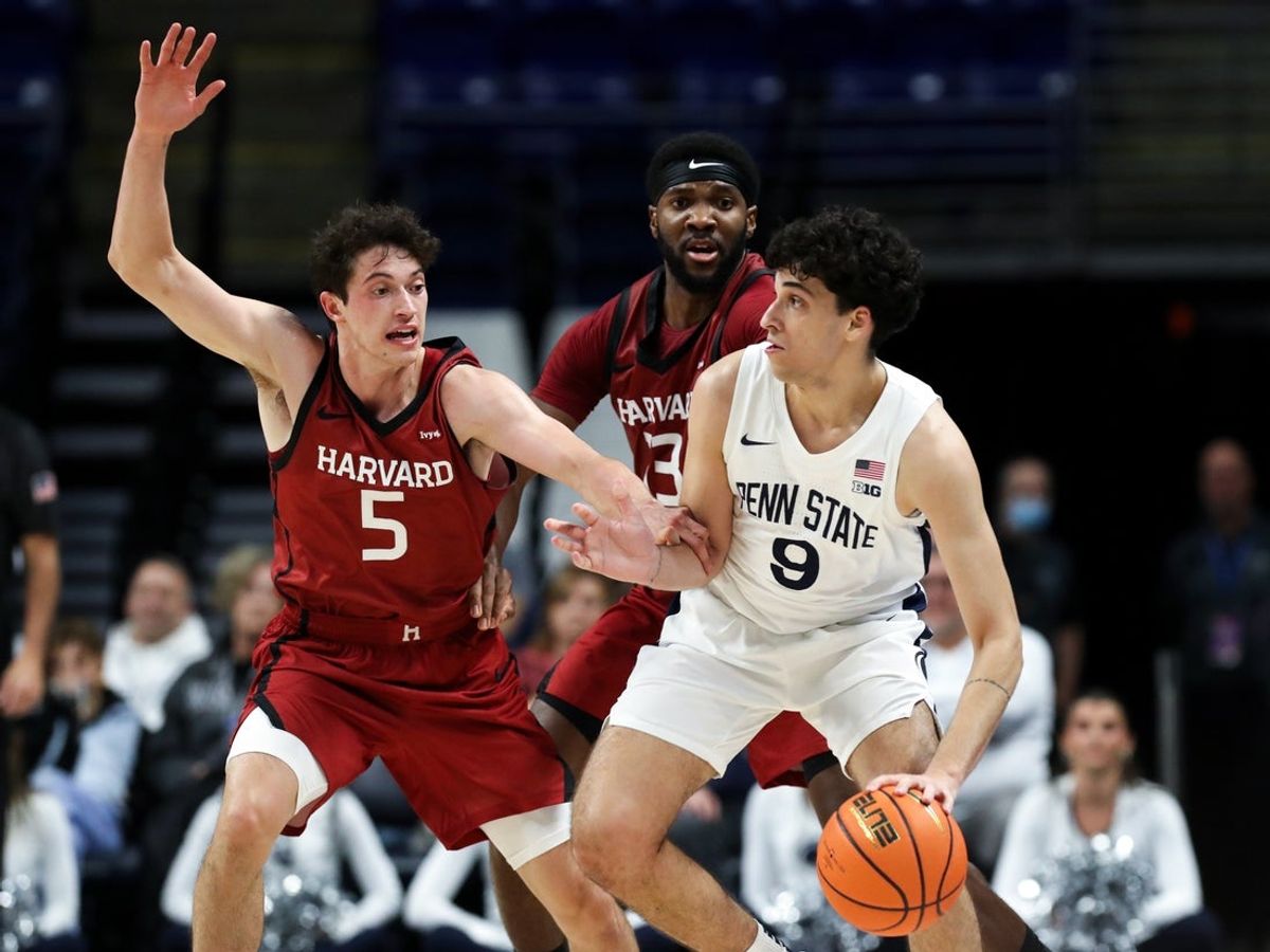 Nov 19, 2025; University Park, Pennsylvania, USA; Penn State Nittany Lions guard Melih Tunca (9) dribbles the ball as Harvard Crimson guard Ben Eisendrath (5) defends during the second half at Bryce Jordan Center. Mandatory Credit: Matthew O'Haren-Imagn Images