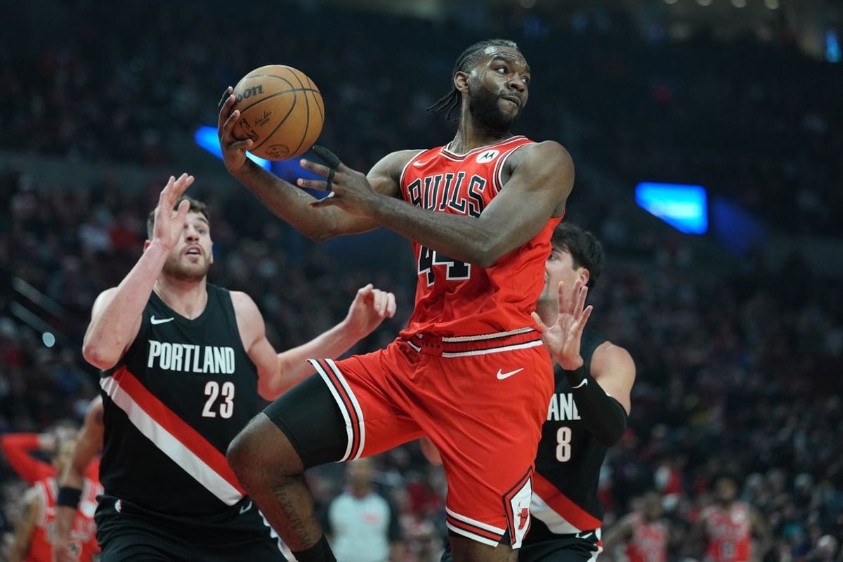 Nov 19, 2025; Portland, Oregon, USA; Chicago Bulls forward Patrick Williams (44) looks to pass the ball against Portland Trail Blazers center Donovan Clingan (23) and forward Deni Avdija (8) during the first half at Moda Center. Mandatory Credit: Soobum Im-Imagn Images
