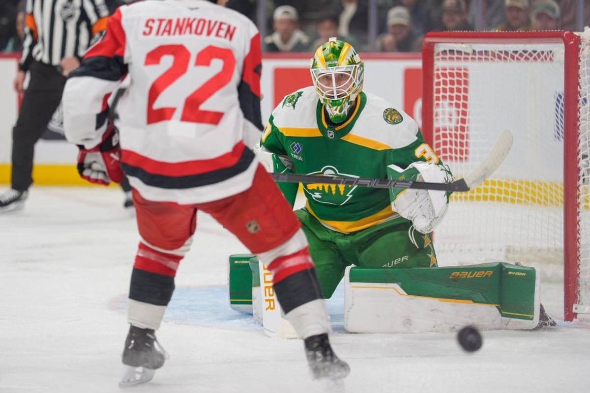 Nov 19, 2025; Saint Paul, Minnesota, USA; Minnesota Wild goaltender Jesper Wallstedt (30) makes a save on Carolina Hurricanes center Logan Stankoven (22) in the first period at Grand Casino Arena. Mandatory Credit: Matt Blewett-Imagn Images