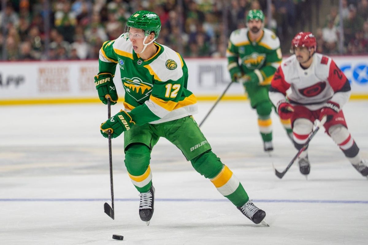 Nov 19, 2025; Saint Paul, Minnesota, USA; Minnesota Wild left wing Matt Boldy (12) skates alone inside the Carolina Hurricanes blue line in the second period at Grand Casino Arena. Mandatory Credit: Matt Blewett-Imagn Images