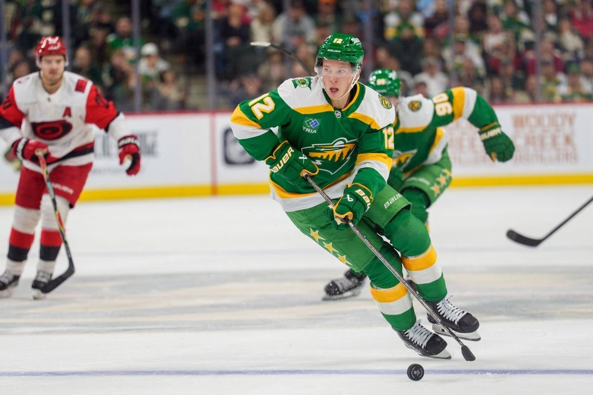 Nov 19, 2025; Saint Paul, Minnesota, USA; Minnesota Wild left wing Matt Boldy (12) skates alone at the Carolina Hurricanes blue line in the second period at Grand Casino Arena. Mandatory Credit: Matt Blewett-Imagn Images
