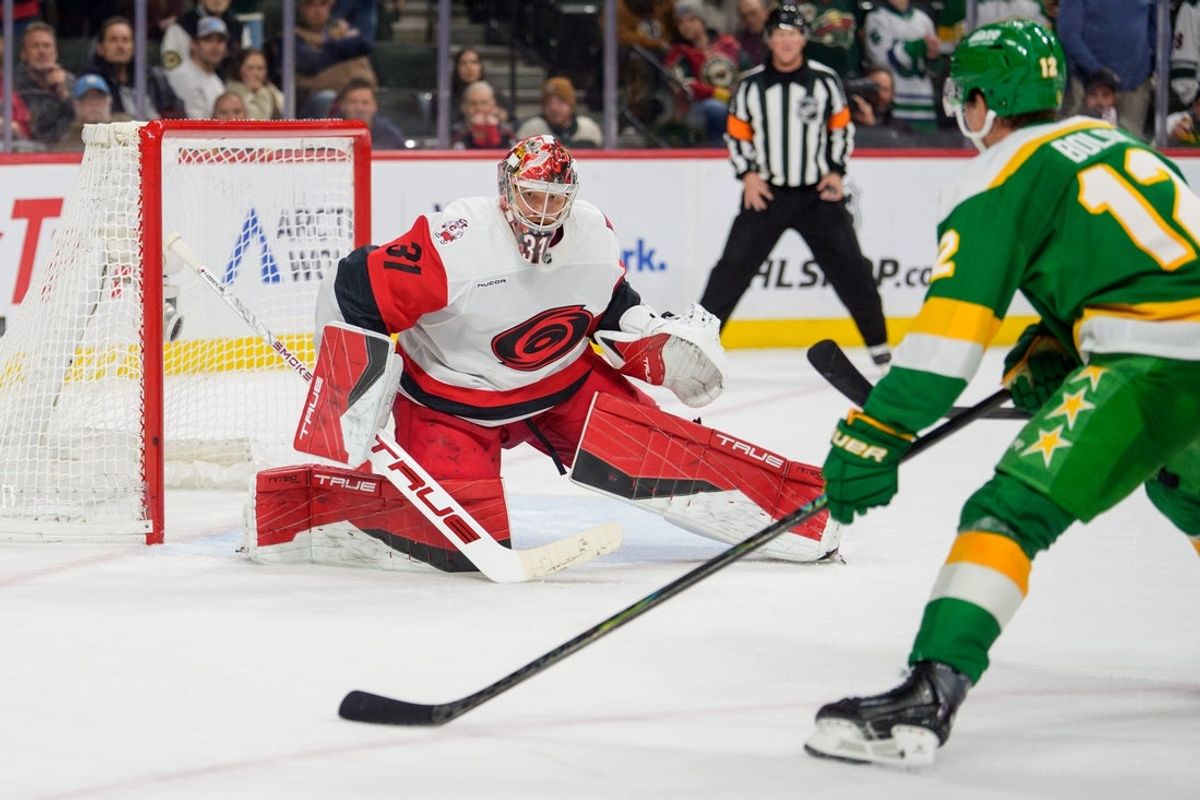 Nov 19, 2025; Saint Paul, Minnesota, USA; Carolina Hurricanes goaltender Frederik Andersen (31) watches Minnesota Wild left wing Matt Boldy (12) come in for the shot in the overtime at Grand Casino Arena. Mandatory Credit: Matt Blewett-Imagn Images