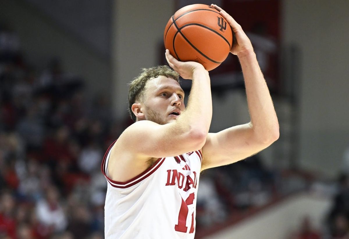 Nov 20, 2025; Bloomington, Indiana, USA; Indiana Hoosiers forward Tucker Devries (12) shoots the ball during the first half against the Lindenwood Lions at Simon Skjodt Assembly Hall. Mandatory Credit: Robert Goddin-Imagn Images