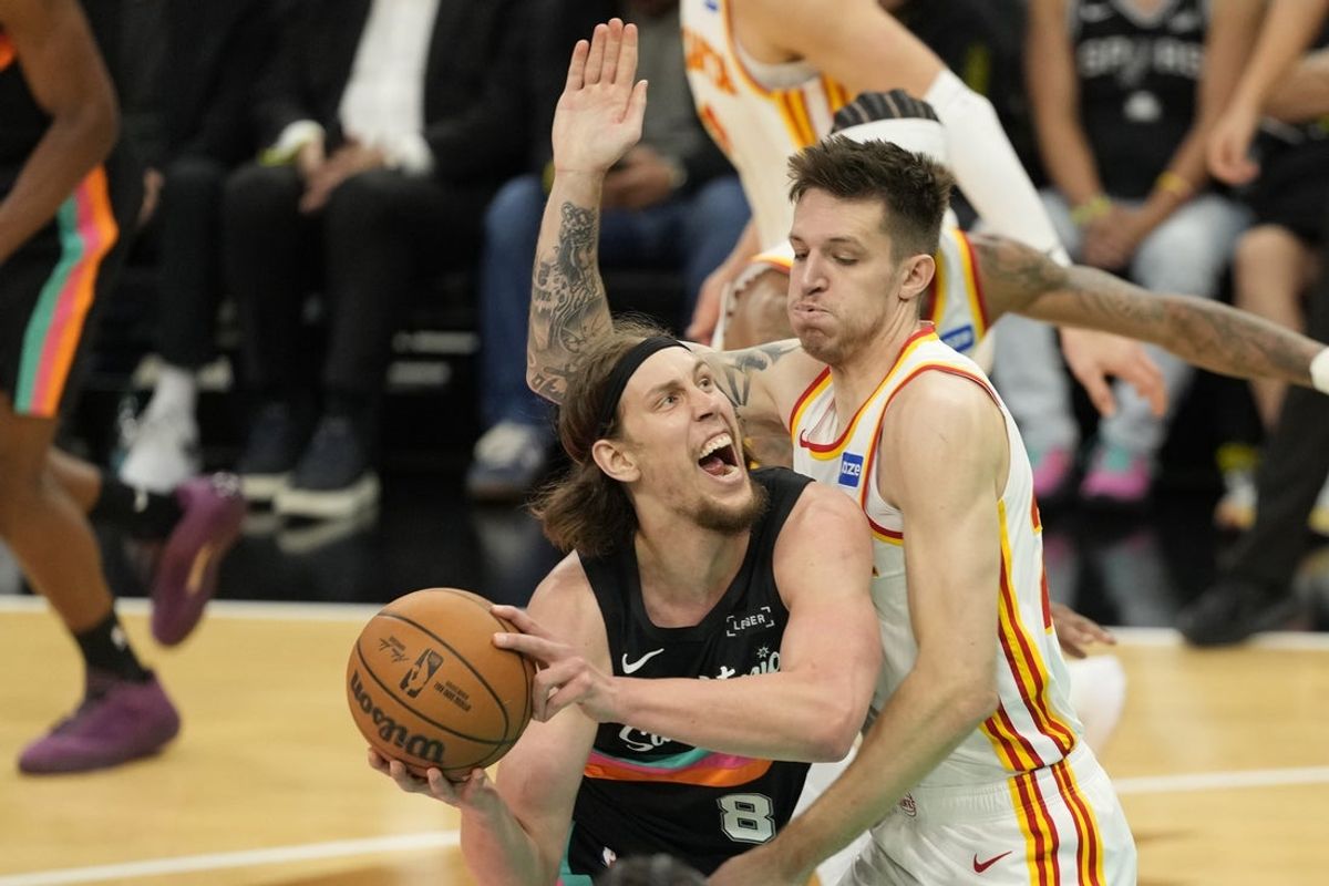Nov 20, 2025; San Antonio, Texas, USA; San Antonio Spurs forward Kelly Olynyk (8) drives to the basket against Atlanta Hawks forward Vit Krejci (27) during the first half at Frost Bank Center. Mandatory Credit: Scott Wachter-Imagn Images