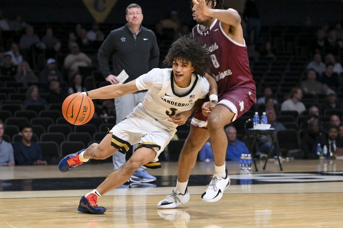 Nov 20, 2025; Nashville, Tennessee, USA;  Vanderbilt Commodores guard Tyler Tanner (3) drives baseline past Texas Southern Tigers forward Anthony Andrews (8) during the second half at Memorial Gymnasium. Mandatory Credit: Steve Roberts-Imagn Images