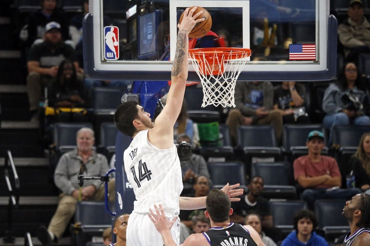 Nov 20, 2025; Memphis, Tennessee, USA; Memphis Grizzlies center Zach Edey (14) dunks during the second quarter against the Sacramento Kings at FedExForum. Mandatory Credit: Petre Thomas-Imagn Images