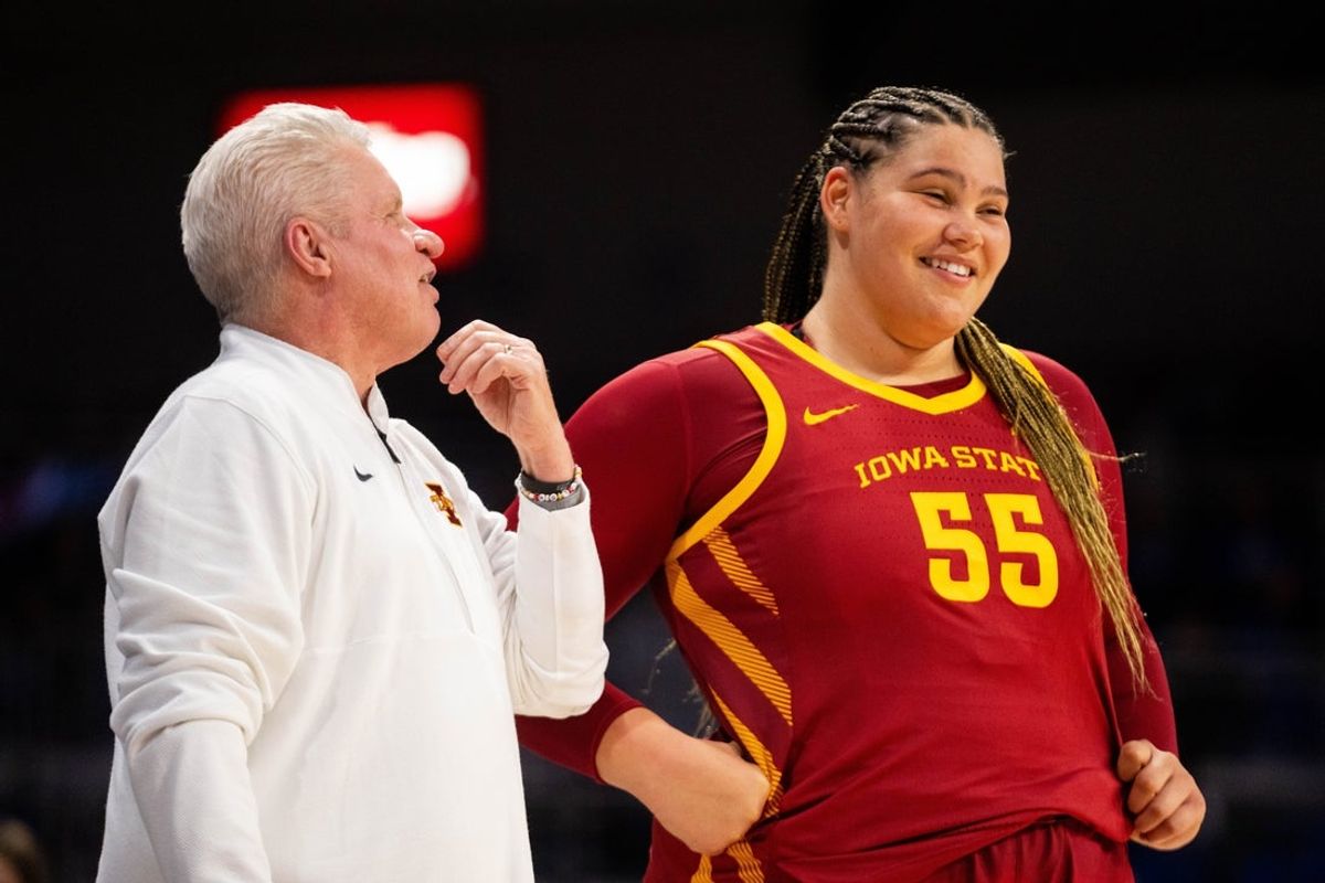 Iowa State's Audi Crooks (55) talks with Iowa State head coach Bill Fennelly ahead of the second half against Drake on Nov. 20, 2025, at the Knapp Center in Des Moines.