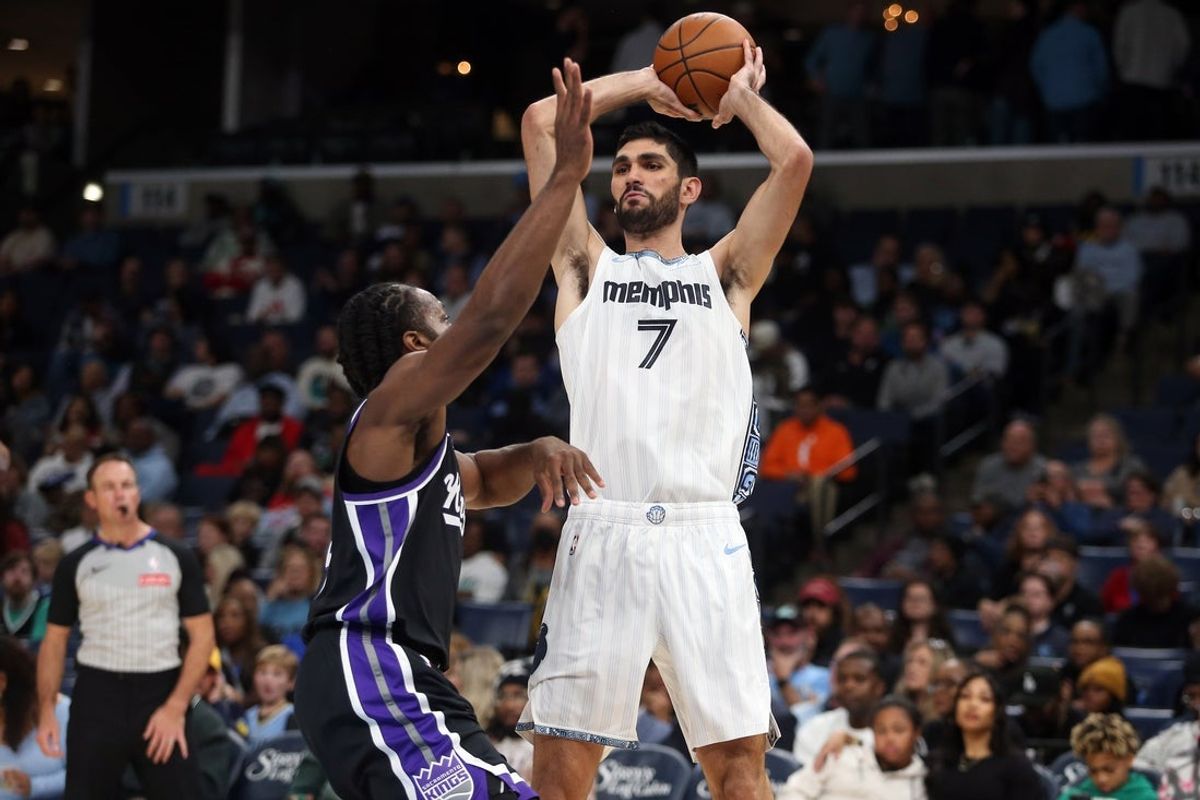 Nov 20, 2025; Memphis, Tennessee, USA; Memphis Grizzlies forward Santi Aldama (7) passes the ball as Sacramento Kings forward Dario Saric (9) defends during the fourth quarter at FedExForum. Mandatory Credit: Petre Thomas-Imagn Images