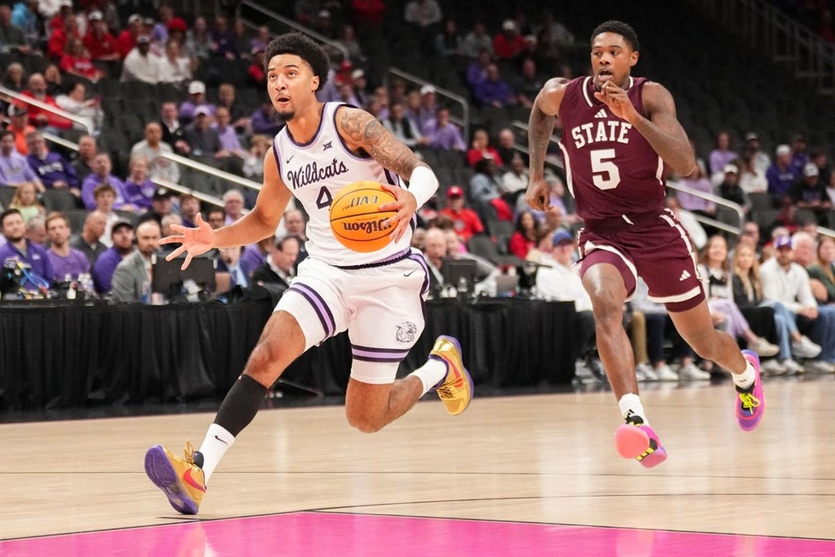 Nov 20, 2025; Kansas City, Missouri, USA; Kansas State Wildcats guard PJ Haggerty (4) dribbles the ball as Mississippi State Bulldogs guard Shawn Jones Jr. (5) defends  during the first half of the game at T-Mobile Center. Mandatory Credit: Denny Medley-Imagn Images