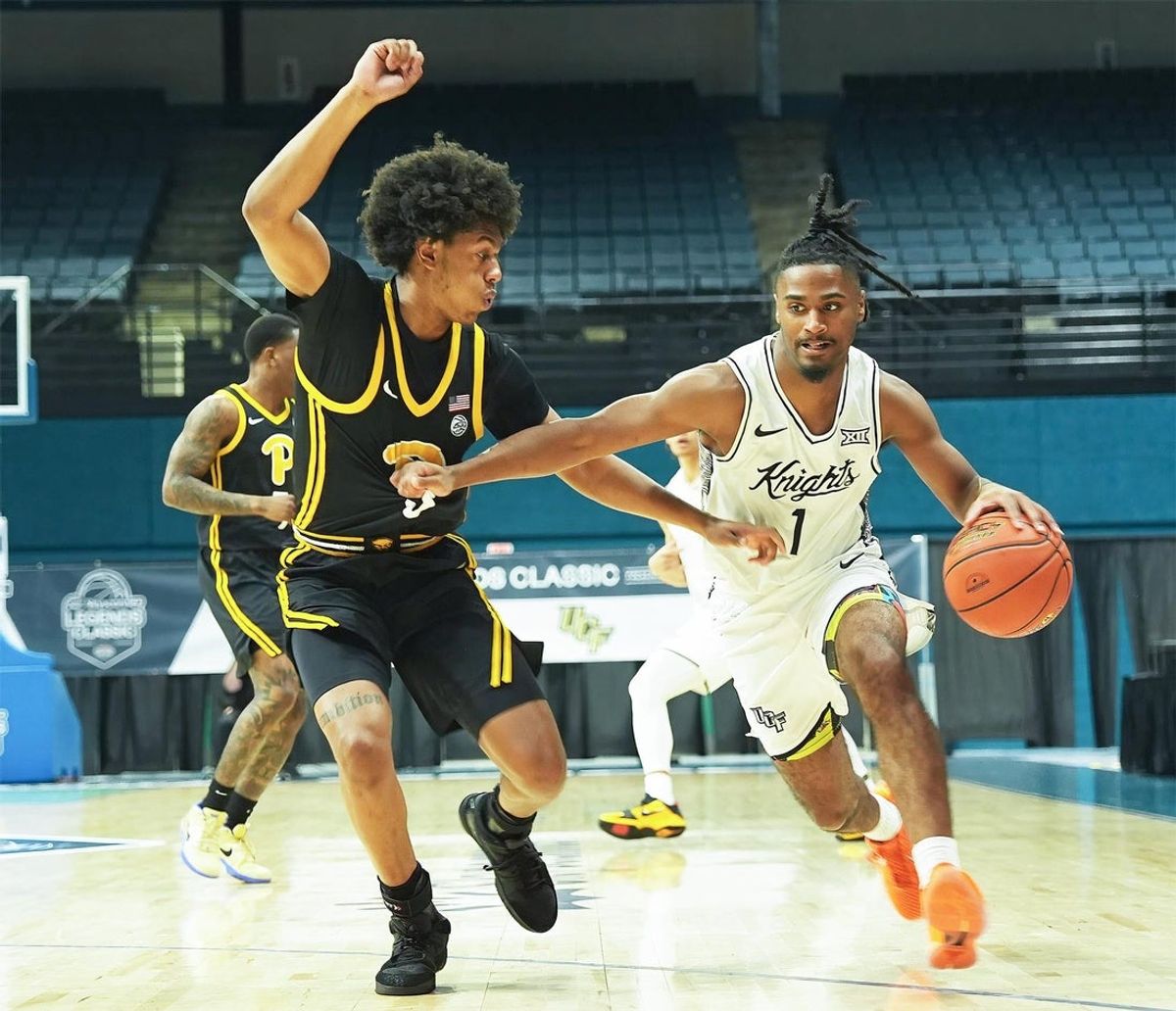 UCF's Themus Fulks (1) dribbles the ball down the court during the basketball game against Pittsburgh, Thursday, Nov. 20, 2025 at the Ocean Center.