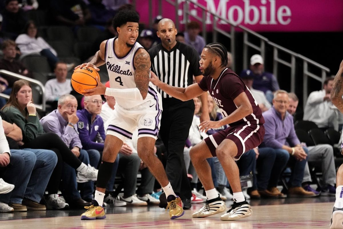 Nov 20, 2025; Kansas City, Missouri, USA; Kansas State Wildcats guard PJ Haggerty (4) controls the ball as Mississippi State Bulldogs guard Jayden Epps (10) defends during the second half of the game at T-Mobile Center. Mandatory Credit: Denny Medley-Imagn Images