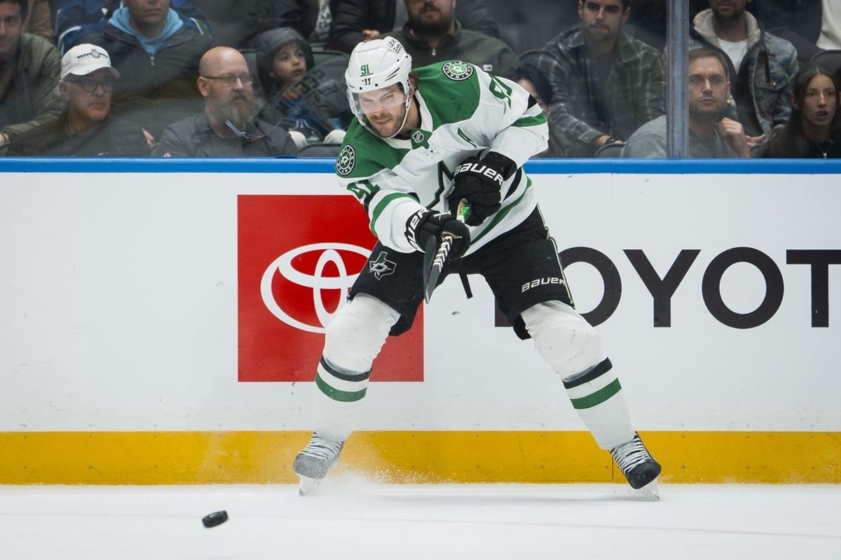 Nov 20, 2025; Vancouver, British Columbia, CAN; Dallas Stars forward Tyler Seguin (91) makes a save against the Vancouver Canucks in the third period at Rogers Arena. Mandatory Credit: Bob Frid-Imagn Images