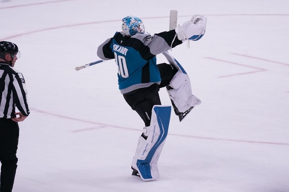 Nov 20, 2025; San Jose, California, USA;  San Jose Sharks goaltender Yaroslav Askarov (30) celebrates after defeating the Los Angeles Kings in the shoot out at SAP Center at San Jose. Mandatory Credit: David Gonzales-Imagn Images