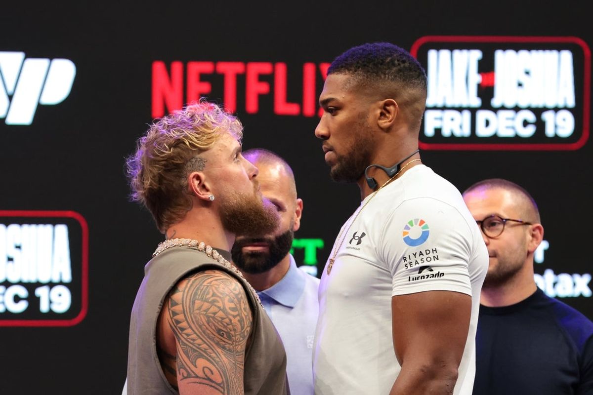 Nov 21, 2025; Miami, Florida, UNITED STATES; Jake Paul and Anthony Joshua face off after a press conference announcing their heavyweight boxing match at Kayesa Center. Mandatory Credit: Sam Navarro-Imagn Images