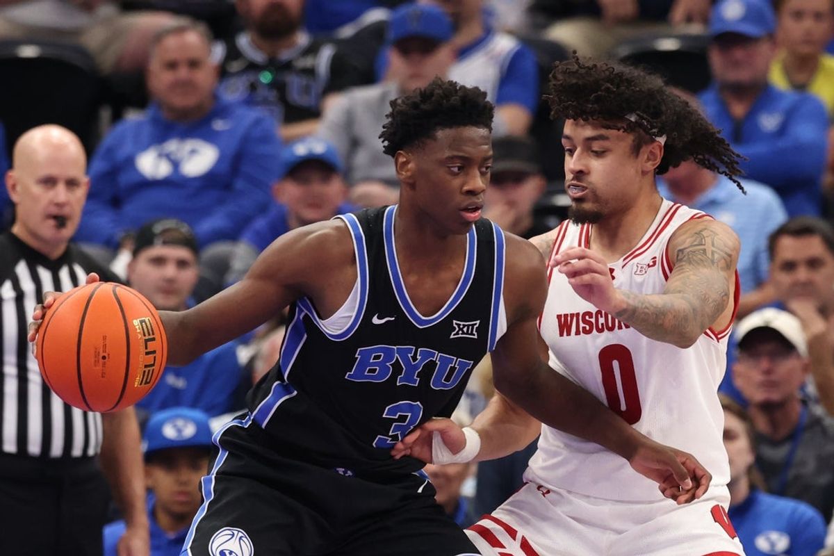 Nov 21, 2025; Salt Lake City, Utah, USA; BYU Cougars forward AJ Dybantsa (3) moves the ball against Wisconsin Badgers guard Braeden Carrington (0) during the first half at Delta Center. Mandatory Credit: Rob Gray-Imagn Images