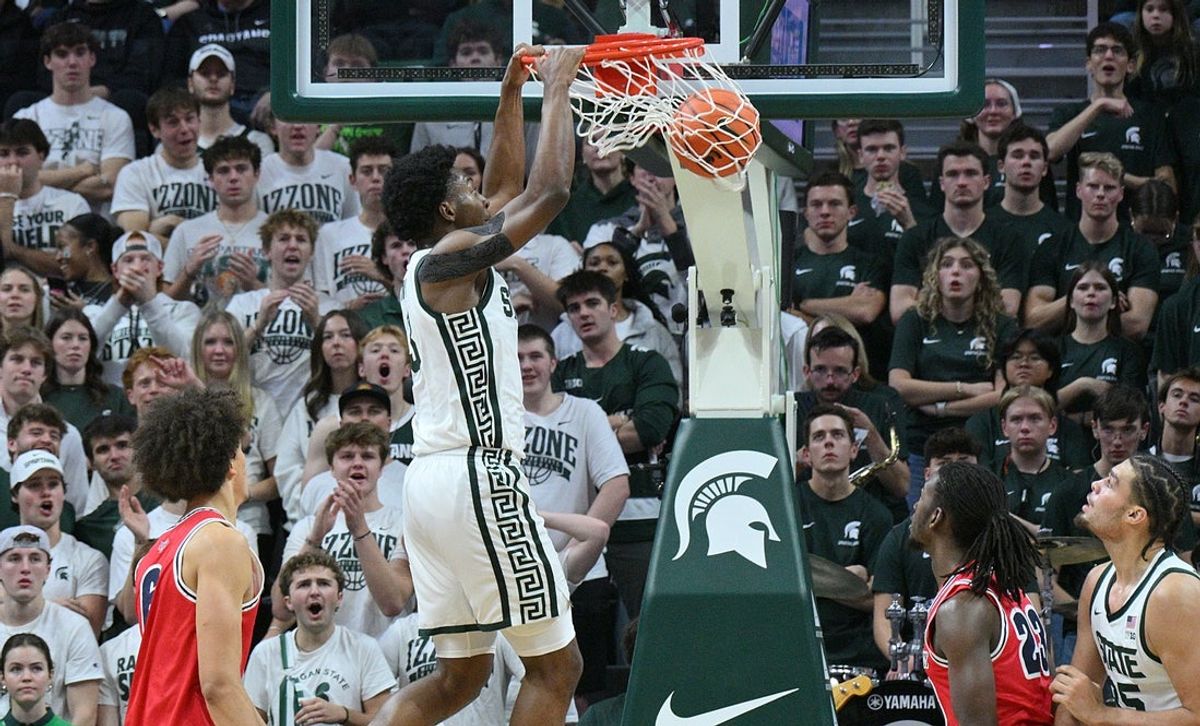 Nov 21, 2025; East Lansing, Michigan, USA;  Michigan State Spartans forward Cameron Ward (3) dunks the ball against the Detroit Mercy Titans during the first half at Jack Breslin Student Events Center. Mandatory Credit: Dale Young-Imagn Images