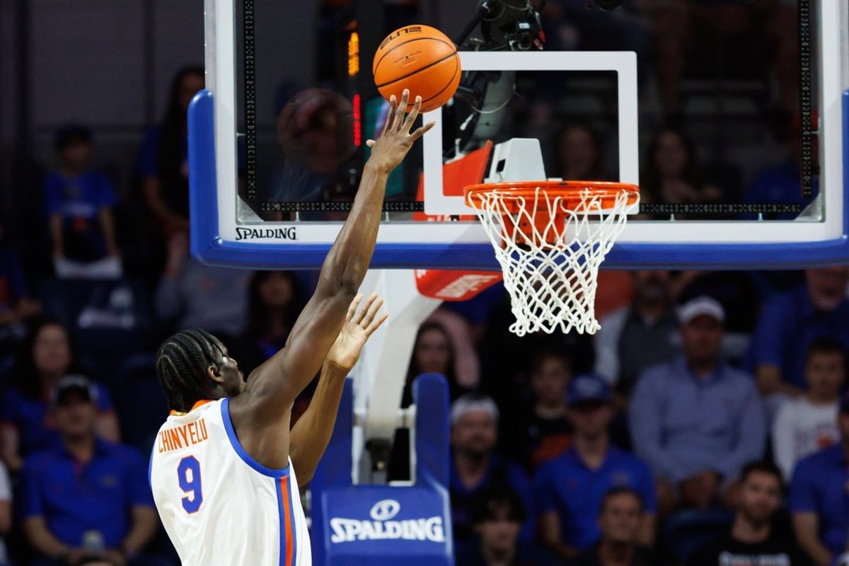 Nov 21, 2025; Gainesville, Florida, USA; Florida Gators center Rueben Chinyelu (9) shoots the ball against the Merrimack Warriors during the first half at Exactech Arena at the Stephen C. O'Connell Center. Mandatory Credit: Matt Pendleton-Imagn Images