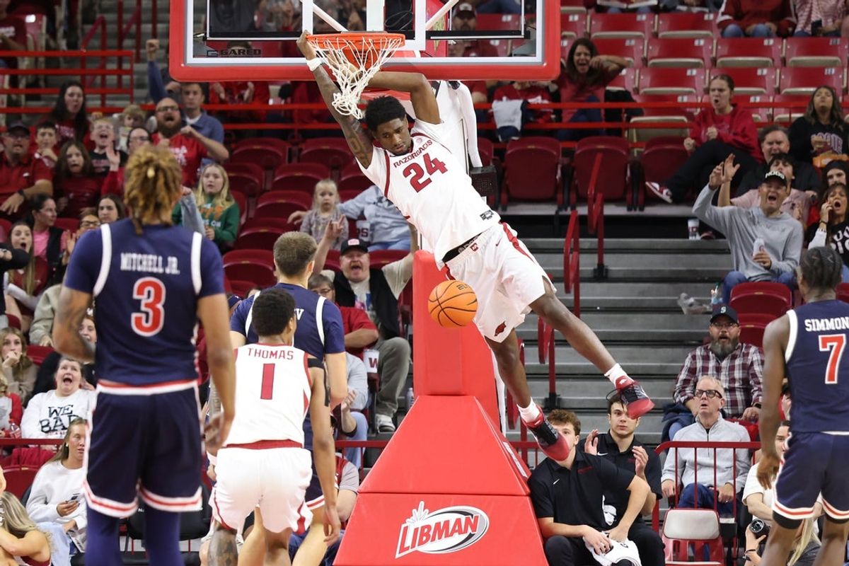 Nov 21, 2025; Fayetteville, Arkansas, USA; Arkansas Razorbacks wing Billy Richmond III (24) dunks the ball in the first half against the Jackson State Tigers at Bud Walton Arena. Mandatory Credit: Nelson Chenault-Imagn Images