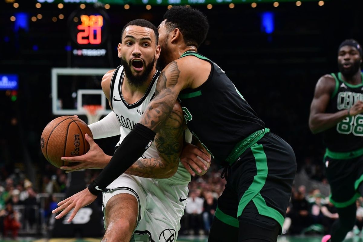 Nov 21, 2025; Boston, Massachusetts, USA; Brooklyn Nets guard Tyrese Martin (13) controls the ball while Boston Celtics guard Anfernee Simons (4) defends during the first half at TD Garden. Mandatory Credit: Bob DeChiara-Imagn Images