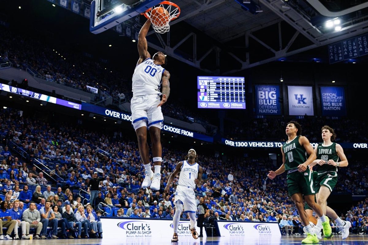 Nov 21, 2025; Lexington, Kentucky, USA; Kentucky Wildcats guard Otega Oweh (00) dunks the ball during the second half against the Loyola (MD) Greyhounds at Rupp Arena at Central Bank Center. Mandatory Credit: Jordan Prather-Imagn Images