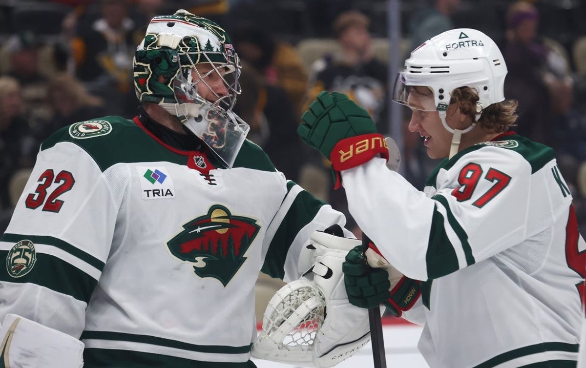Nov 21, 2025; Pittsburgh, Pennsylvania, USA;  Minnesota Wild goaltender Filip Gustavsson (32) and left wing Kirill Kaprizov (97) celebrate after defeating the Pittsburgh Penguins at PPG Paints Arena. Mandatory Credit: Charles LeClaire-Imagn Images