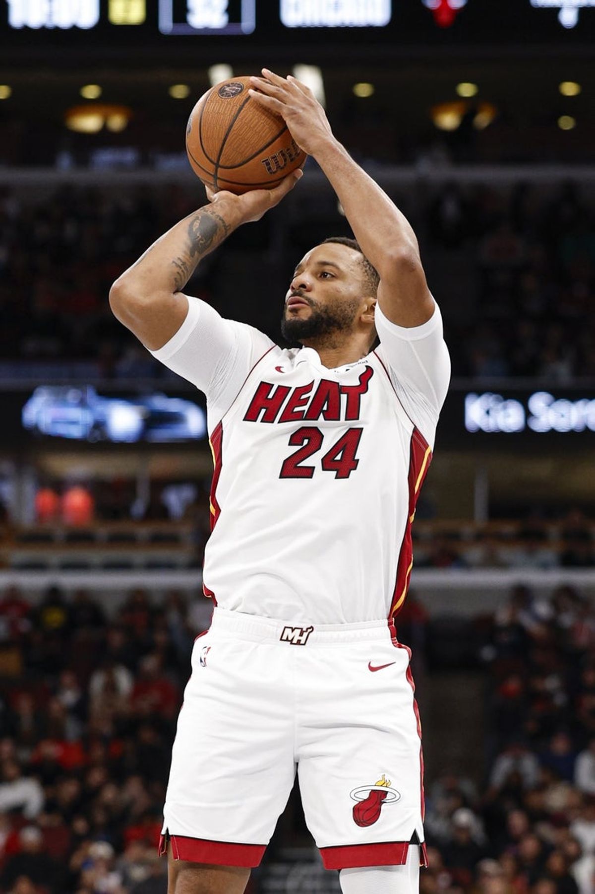 Nov 21, 2025; Chicago, Illinois, USA; Miami Heat guard Norman Powell (24) shoots against the Chicago Bulls during the second half at United Center. Mandatory Credit: Kamil Krzaczynski-Imagn Images