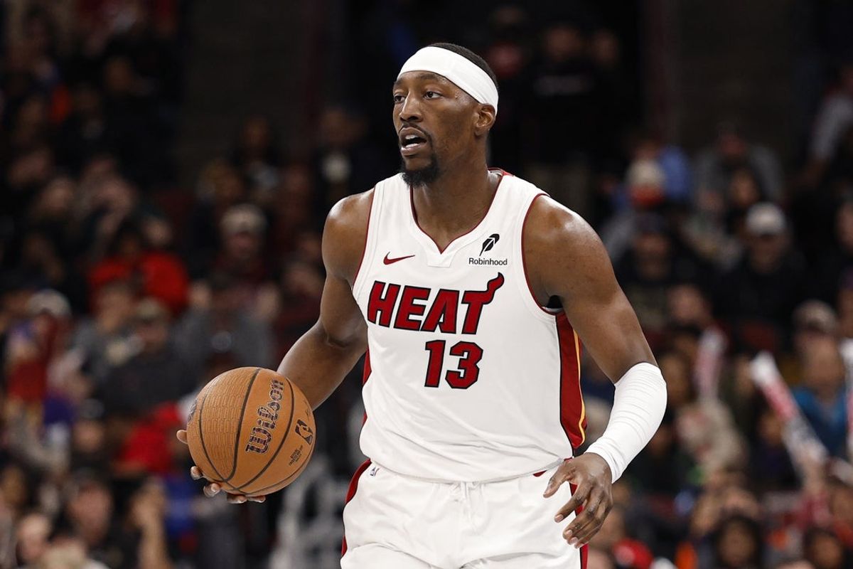 Nov 21, 2025; Chicago, Illinois, USA; Miami Heat center Bam Adebayo (13) brings the ball up court against the Chicago Bulls during the second half at United Center. Mandatory Credit: Kamil Krzaczynski-Imagn Images
