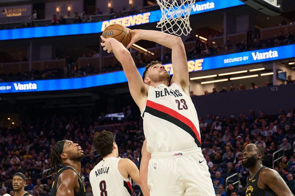 Nov 21, 2025; San Francisco, California, USA; Portland Trail Blazers center Donovan Clingan (23) rebounds the ball against the Golden State Warriors during the second quarter at Chase Center. Mandatory Credit: Robert Edwards-Imagn Images