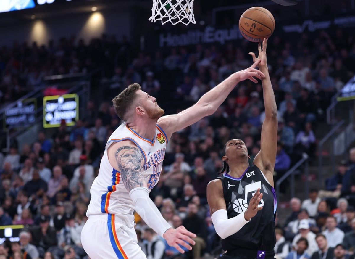 Nov 21, 2025; Salt Lake City, Utah, USA;Utah Jazz forward Cody Williams (5) goes to the basket against Oklahoma City Thunder center Isaiah Hartenstein (55) during the second half at Delta Center. Mandatory Credit: Rob Gray-Imagn Images