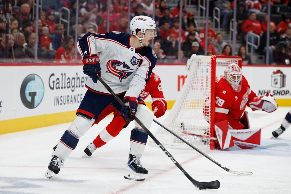 Nov 22, 2025; Detroit, Michigan, USA;  Columbus Blue Jackets defenseman Zach Werenski (8) skates with the puck in the first period against the Detroit Red Wingsat Little Caesars Arena. Mandatory Credit: Rick Osentoski-Imagn Images