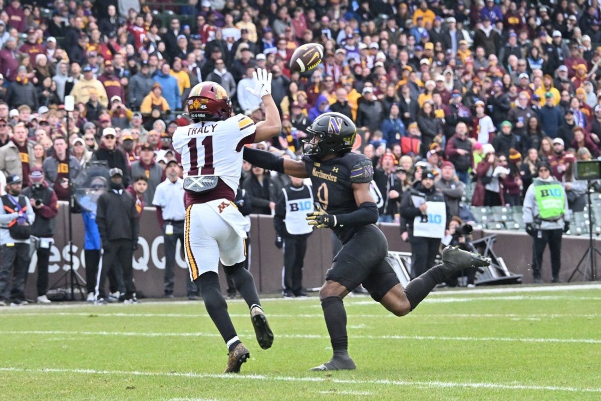 Nov 22, 2025; Chicago, Illinois, USA; Minnesota Golden Gophers wide receiver Javon Tracy (11) receives a pass prior to running in for a tocuhdown against the Northwestern Wildcats during the first half at Wrigley Field. Mandatory Credit: Patrick Gorski-Imagn Images
