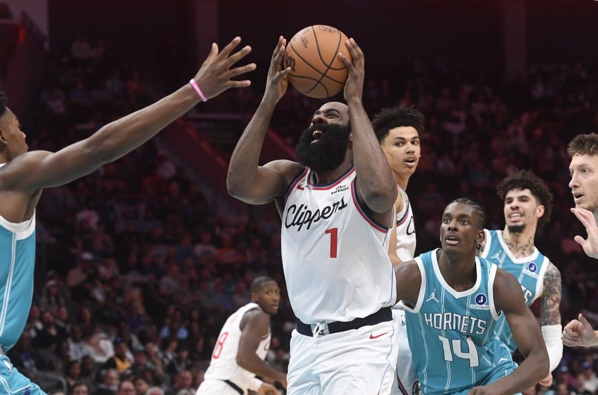 Nov 22, 2025; Charlotte, North Carolina, USA; Los Angeles Clippers guard James Harden (1) drives in during the second half against the Charlotte Hornets at the Spectrum Center. Mandatory Credit: Sam Sharpe-Imagn Images