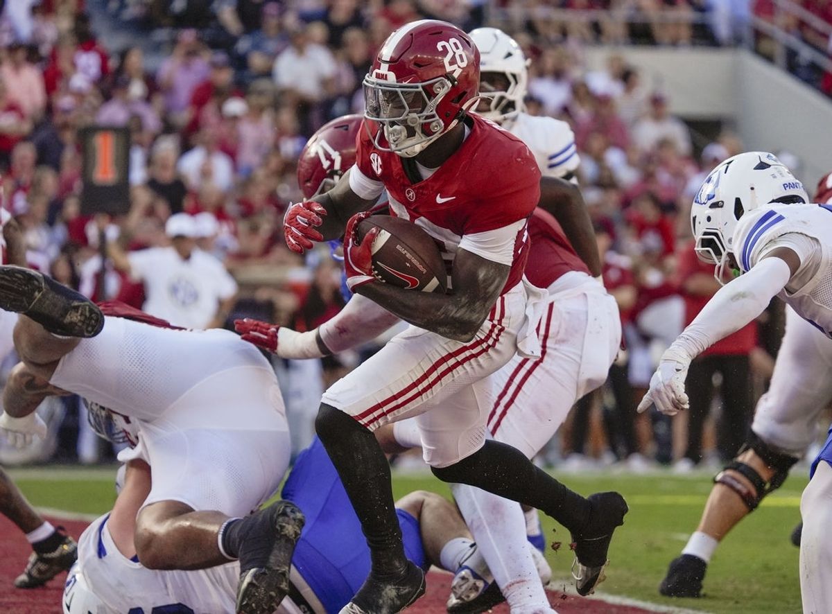 Nov 22, 2025; Tuscaloosa, Alabama, USA;  Alabama running back Kevin Riley (28) scores on a running play against Eastern Illinois at Saban Field at Bryant-Denny Stadium. Mandatory Credit: Gary Cosby Jr.-Imagn Images