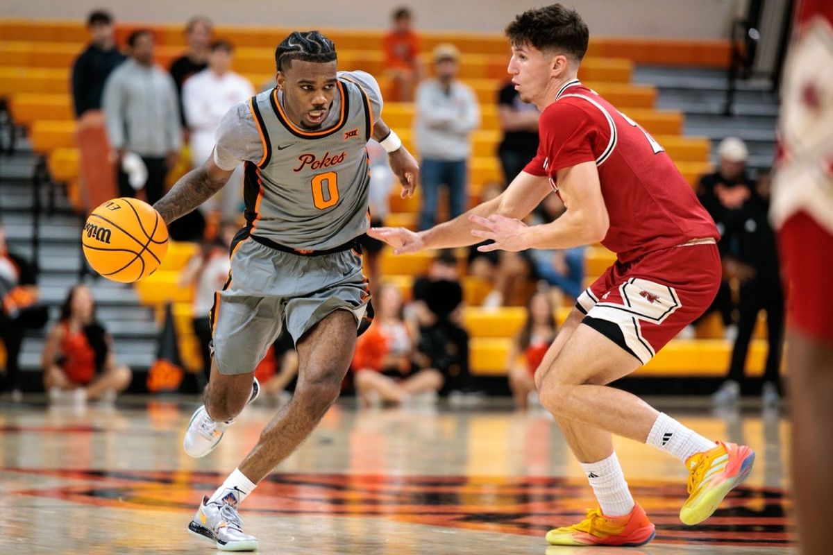 Nov 22, 2025; Stillwater, Oklahoma, USA; Oklahoma State Cowboys guard Jaylen Curry (0) drives to the basket during the second half against the Nicholls Colonels at Gallagher-Iba Arena. Mandatory Credit: William Purnell-Imagn Images