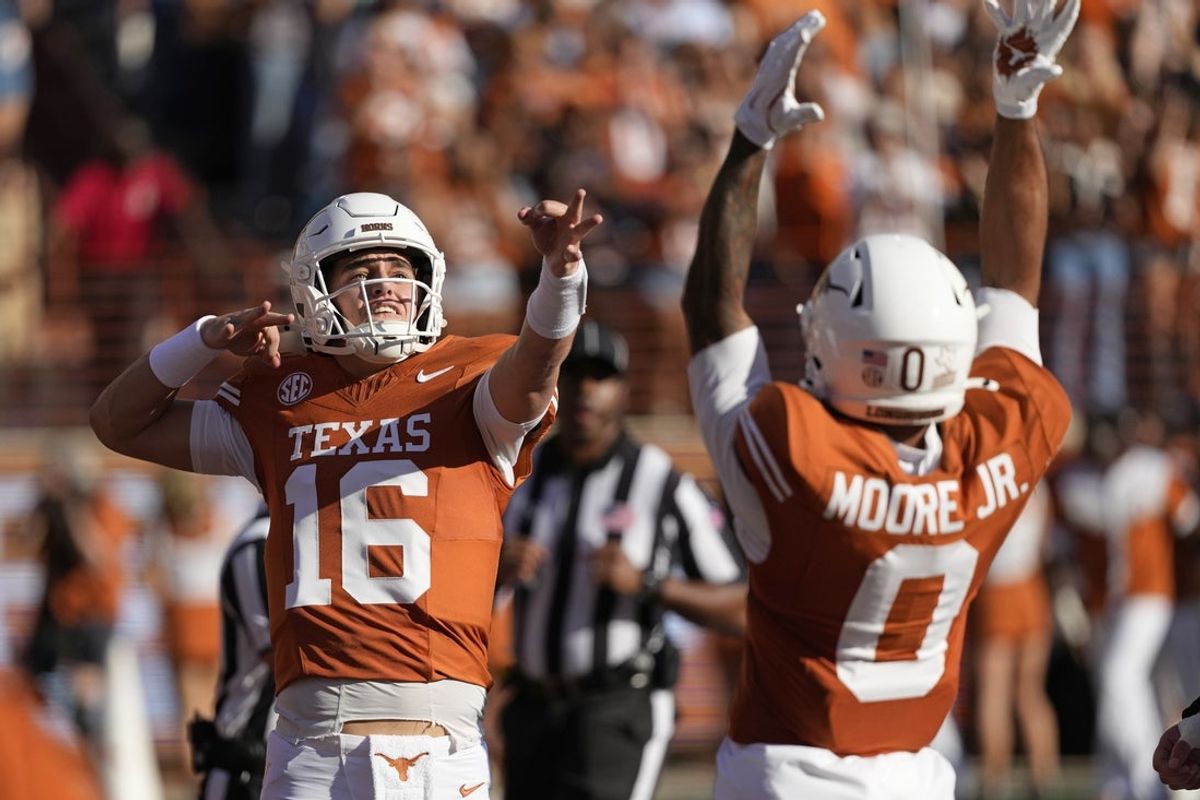 Nov 22, 2025; Austin, Texas, USA; Texas Longhorns quarterback Arch Manning (16) reacts after throwing a touchdown pass in the first half against the Arkansas Razorbacks at Darrell K Royal-Texas Memorial Stadium. Mandatory Credit: Scott Wachter-Imagn Images
