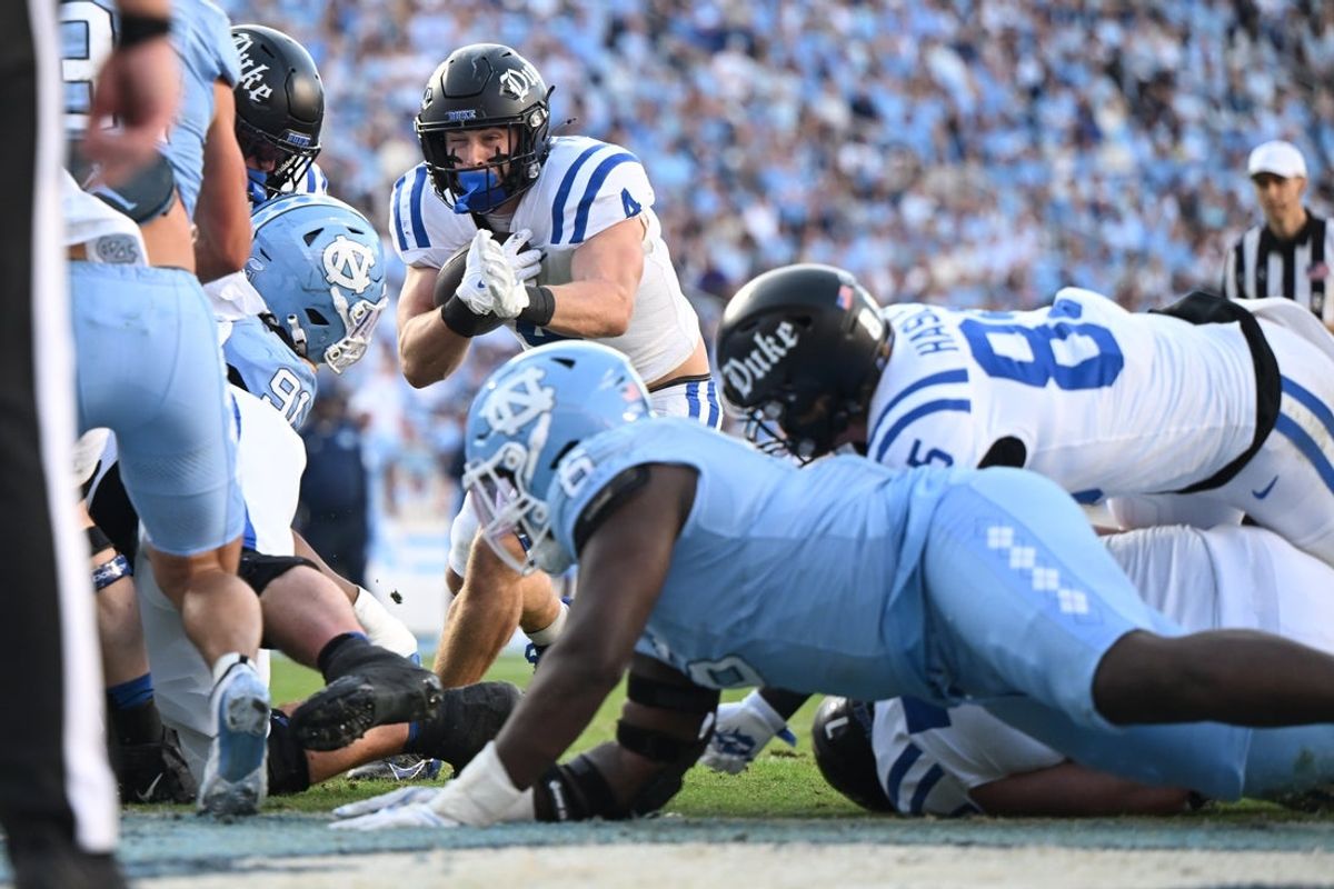Nov 22, 2025; Chapel Hill, North Carolina, USA; Duke Blue Devils running back Anderson Castle (4) rushes for a touchdown during the first half at Kenan Stadium. Mandatory Credit: William Howard-Imagn Images