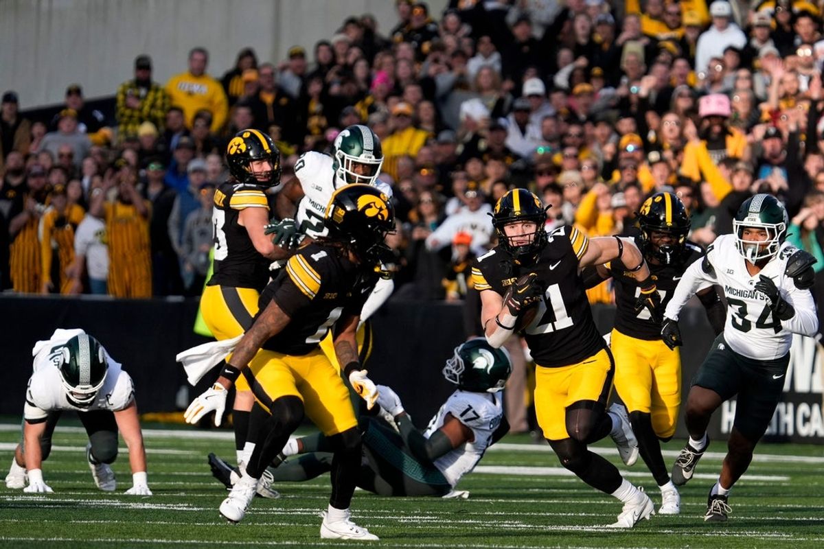 Iowa Hawkeyes wide receiver Kaden Wetjen (21) returns a punt to the endzone against the Michigan State Spartans Nov. 22, 2025 at Kinnick Stadium in Iowa City, Iowa.