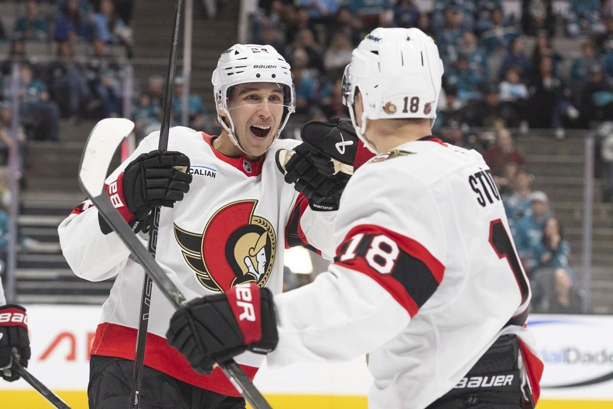 Nov 22, 2025; San Jose, California, USA;  Ottawa Senators center Dylan Cozens (24) reacts with Ottawa Senators center Tim Stützle (18) after scoring a goal during the first period against the San Jose Sharks at SAP Center at San Jose. Mandatory Credit: Stan Szeto-Imagn Images